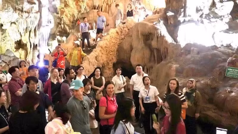 Visitors explore Thien Cung Cave in Ha Long Bay.