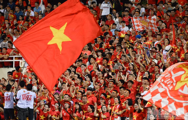 Viet Nam fans turn the stands at My Dinh Stadium red as they cheer on coach Kim Sang Sik and his players.