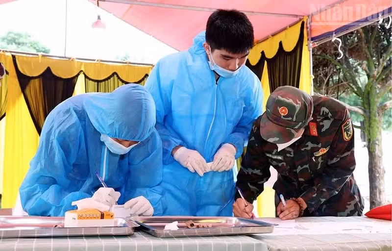 Biological samples are collected at the Thuan Chau Commune Martyrs' Cemetery as part of efforts to identify the remains of unidentified war martyrs through DNA analysis.