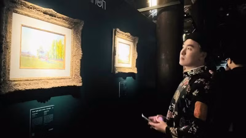 Visitors attend the exhibition at the opening ceremony.