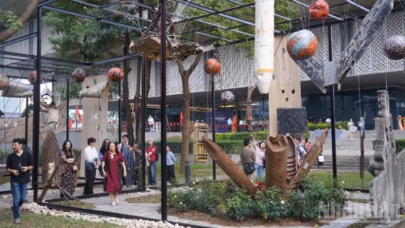 Aircraft wreckage and bomb casings are arranged to create an art space.