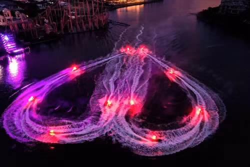 A romantic water display by Jetski athletes in the Awaken River show A romantic water display by Jetski athletes in the Awaken River show