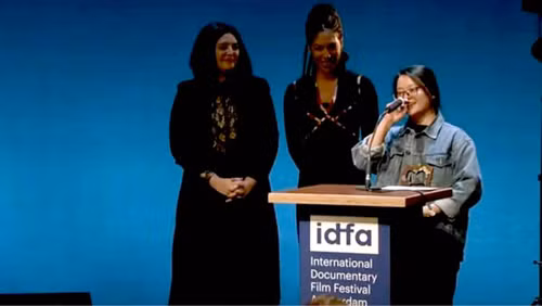 Ha Le Diem speaking at the International Documentary Film Festival in Amsterdam.