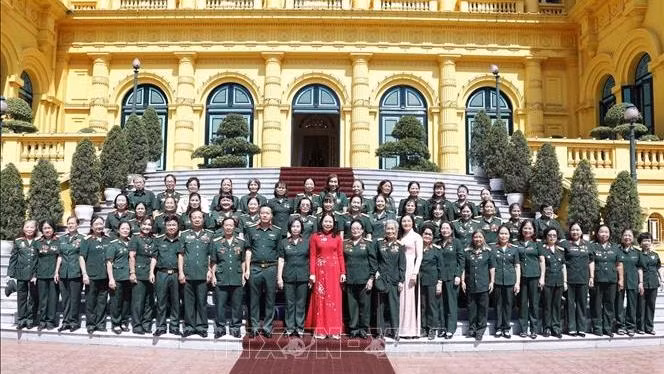 Vice President Vo Thi Anh Xuan (in red) and delegates at the event (Photo: VNA)