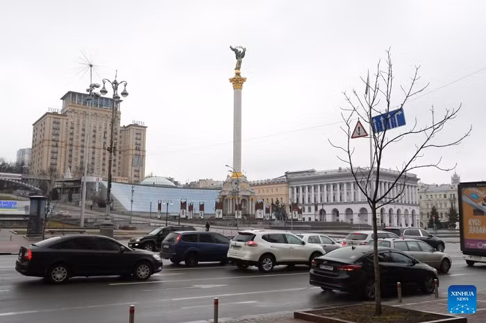 Vehicles travel past the Independence Square in Kiev, Ukraine, Feb. 24, 2022. (Photo: Xinhua)