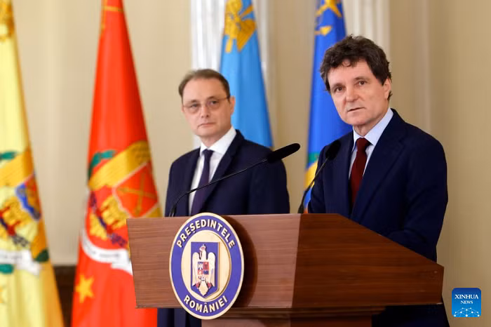 Romanian President Nicusor Dan (R) speaks at a press conference in Bucharest, Romania, Oct. 5, 2026. Nicusor Dan designated Luca Niculescu, state secretary at the Ministry of Foreign Affairs, to form the government on Monday evening, according to Romania's national news agency Agerpres. (Photo: Xinhua)