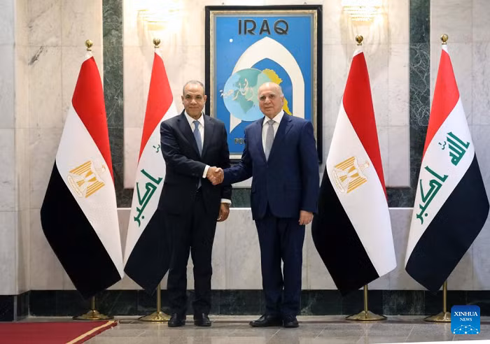 Iraqi Foreign Minister Fuad Hussein (R) shakes hands with his Egyptian counterpart Badr Abdelatty in Baghdad, Iraq, on April 9, 2026. Hussein met with Abdelatty here on Thursday evening to discuss regional de-escalation and the upcoming U.S.-Iran negotiations. (Photo: Xinhua)
