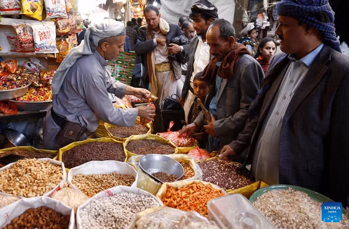 Yemenis buy sweets and nuts before the upcoming Eid al-Adha at a market in Sanaa, Yemen, May 25, 2026. (Photo: Xinhua)