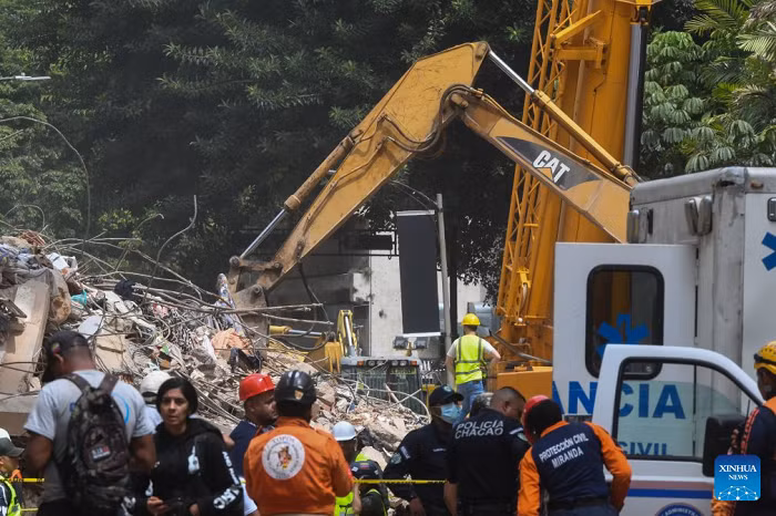 An excavator works on a collapsed building in Chacao, Venezuela, on June 28, 2026. Venezuelan National Assembly President Jorge Rodriguez said Sunday that the death toll from two powerful earthquakes that struck Venezuela Wednesday has risen to 1,450. (Photo: Xinhua)