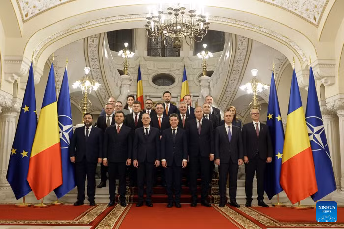 Romania's new Prime Minister Luca Niculescu (front 3rd, L) and President Nicusor Dan (front 4th, L) pose with members of the new government after a swearing-in ceremony at the Cotroceni Palace in Bucharest, Romania, on Oct. 20, 2026. Romania's new government led by Luca Niculescu took the oath of office before Romanian President Nicusor Dan at the Cotroceni Palace on Tuesday evening. (Photo: Xinhua)