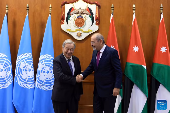 Jordan's Deputy Prime Minister and Minister of Foreign Affairs and Expatriates Ayman Safadi (R) shakes hands with UN Secretary-General Antonio Guterres during their meeting in Amman, Jordan, July 27, 2026. (Photo: Xinhua)