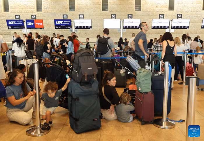 Stranded passengers wait at the Ben Gurion International Airport near Tel Aviv, Israel, Aug. 20, 2026. Takeoffs from Israel's Ben Gurion International Airport were halted on Thursday due to a sudden strike, according to a statement from the Israel Airports Authority and media reports. (Photo: Xinhua) 