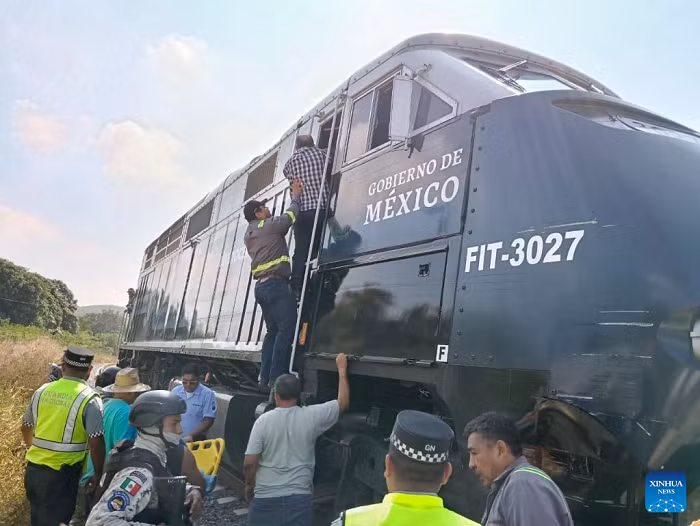 This photo taken with a mobile phone on Dec. 28, 2025 shows the site of a train derailment accident in Municipality of Asuncion Ixtaltepec, State of Oaxaca, Mexico. A passenger train carrying 241 passengers and nine crew members derailed on a bridge near Nizanda in southern Mexico on Sunday, leaving at least 13 people dead and 98 others injured, the Secretariat of the Navy said on social media. (Str/Xinhua)