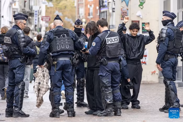Security personnel work on the street in Lille, France, Oct. 24, 2026. Around 410,000 people took part in a new round of protests across France on Saturday, French news channel BFM TV reported, citing the Interior Ministry. (Photo: Xinhua)