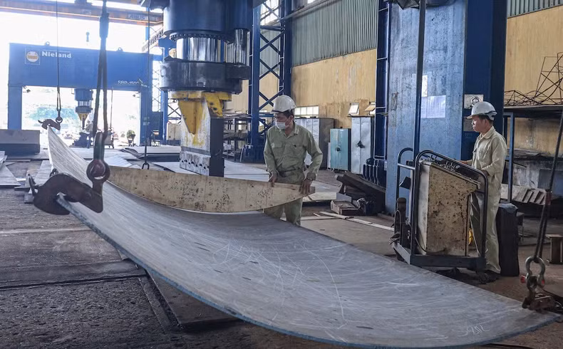 Workers of Song Cam Shipbuilding Company construct a tug-push ship for the ship owner Damen (the Netherlands).