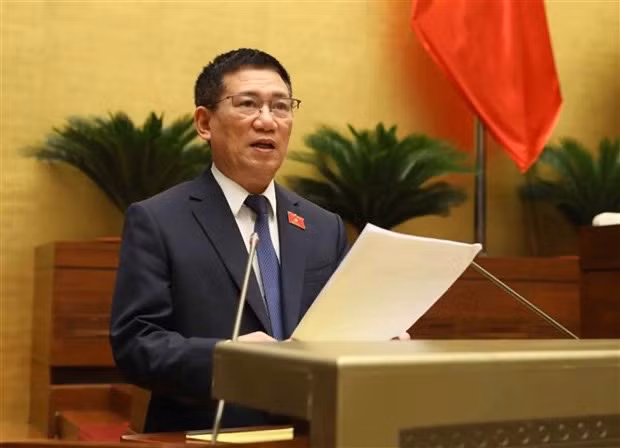 Minister of Finance Ho Duc Phoc delivers the Government's report on thrift practice and wastefulness prevention in 2022 at the 15th NA's fifth session on May 23. (Photo: VNA)