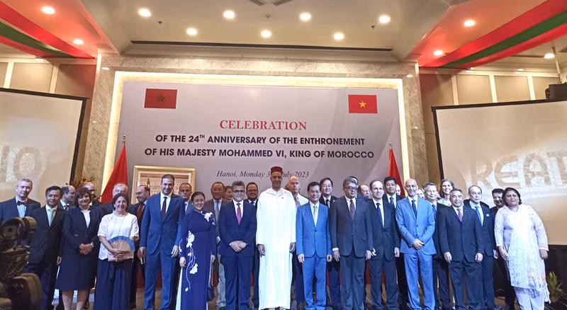 The delegates pose for a photo at the celebration. The delegates pose for a photo at the celebration.
