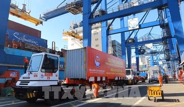 Containers being loaded at Tan Cang - Cat Lai Port in HCM City. (Photo: VNA)