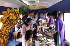 Passengers enjoy a meal aboard the Hue-Da Nang heritage train.