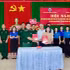 Representatives of the Tuy Hoa Border Guard Station command and Nguyen Hue High School sign a twinning programme. (Photo: NGUYEN LAN)