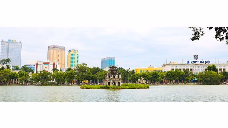 The Turtle Tower, the post office and the People’s Committee headquarters viewed from Le Thai To Street.
