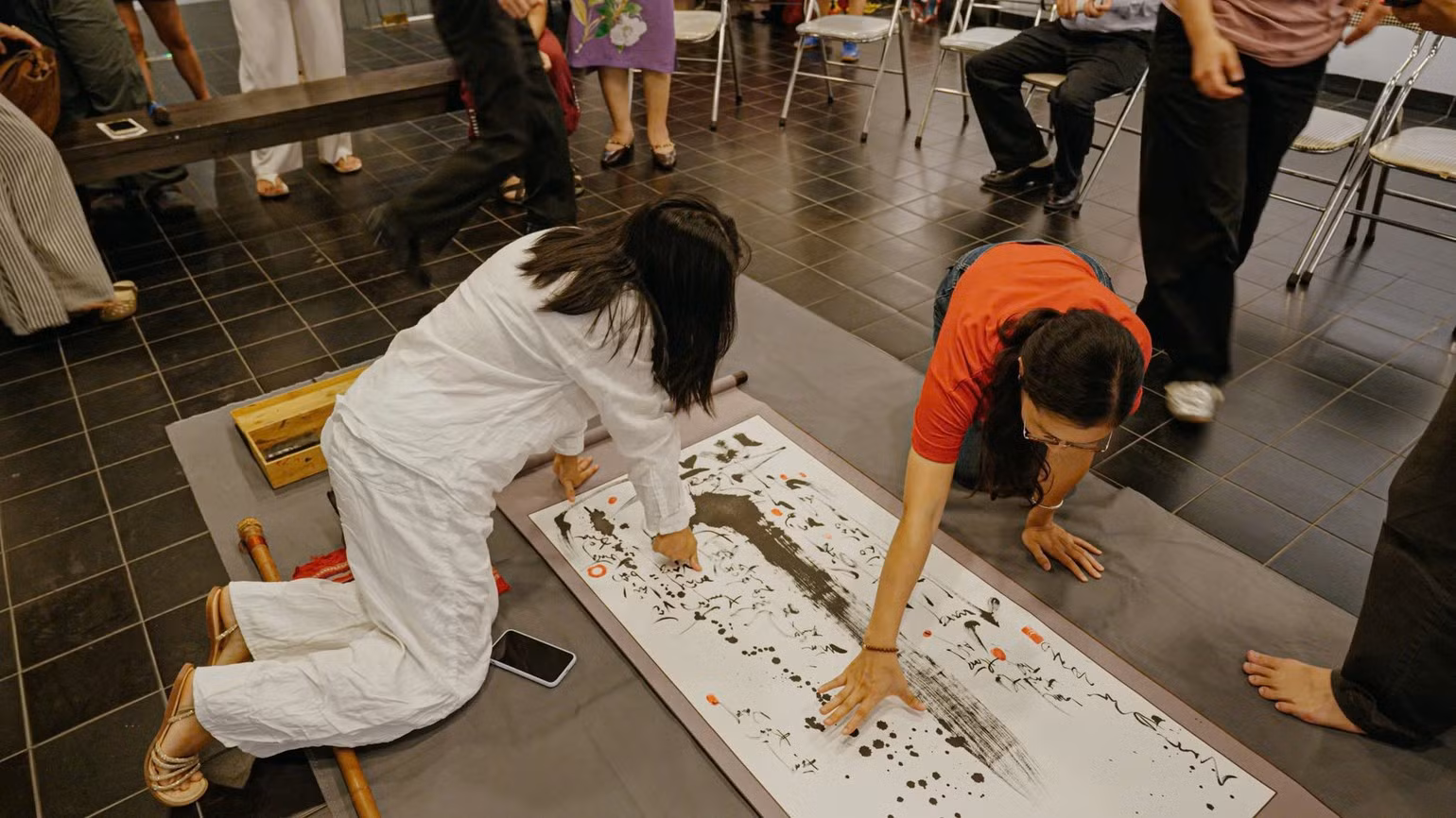 Visitors engage directly with the artworks at the exhibition.