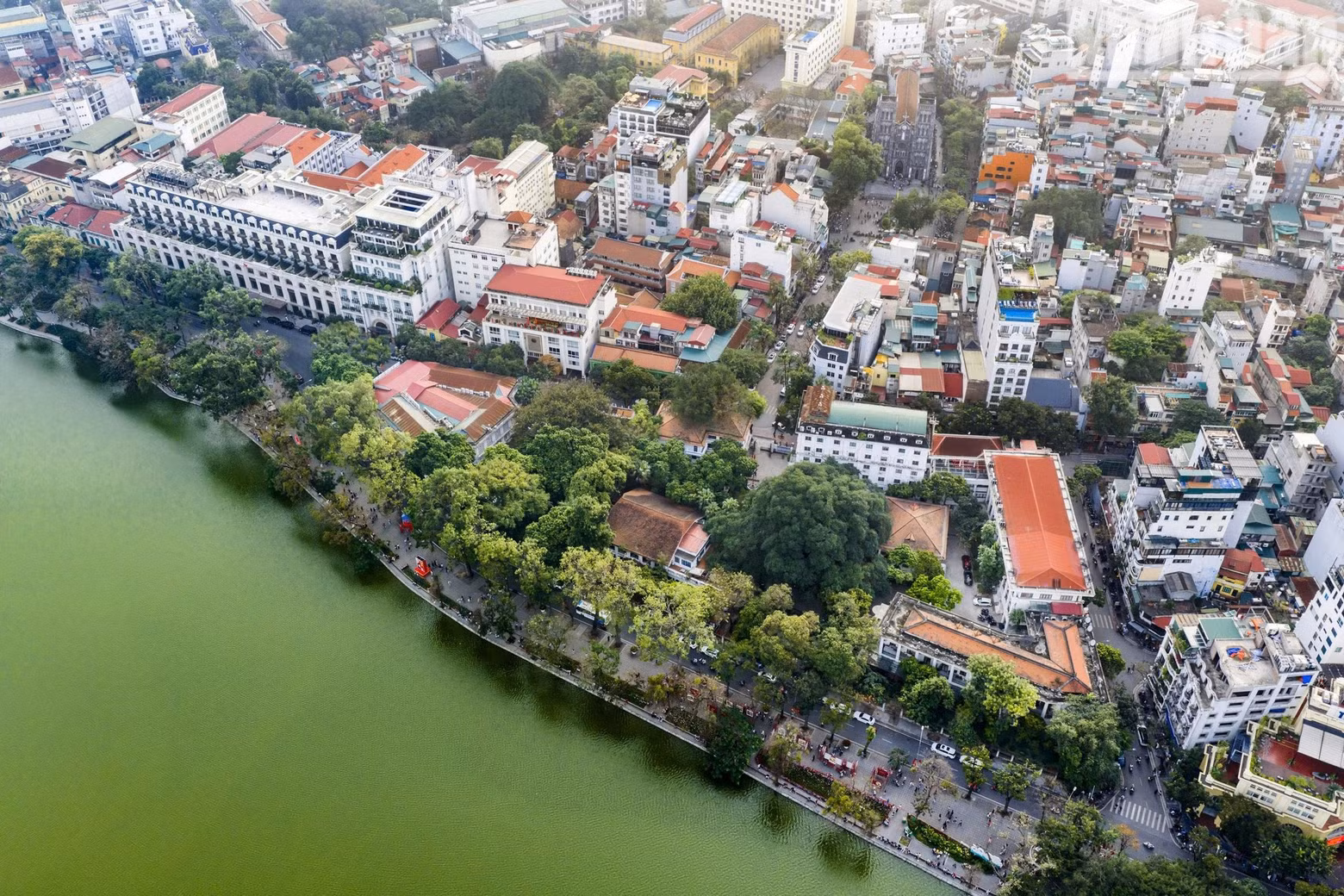 The Nhan Dan Newspaper headquarters is shaded by lush greenery along Le Thai To Street. (Photo: THANH DAT)
