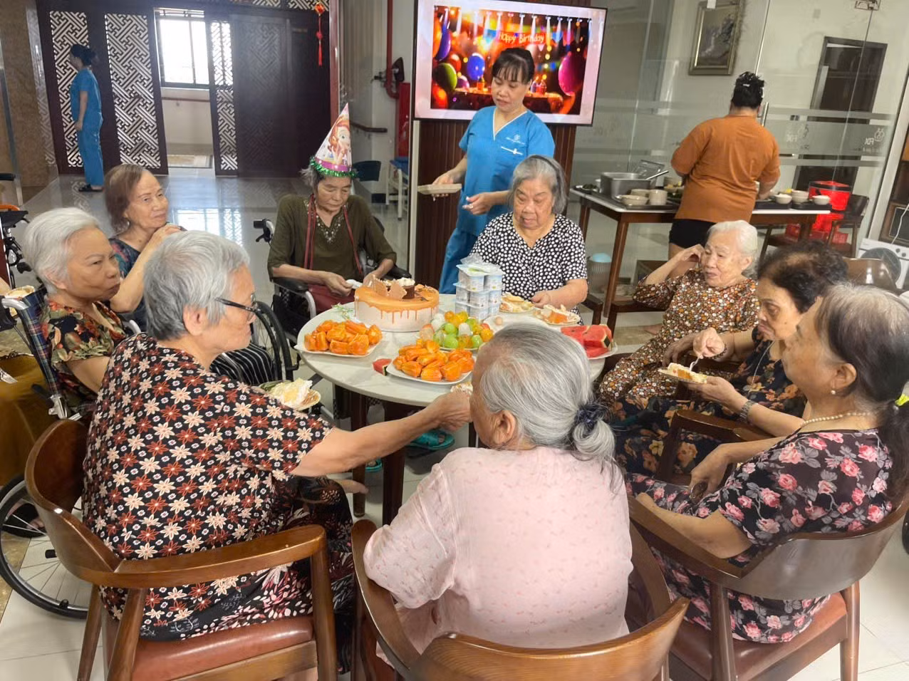 Older people celebrate a birthday at the FDC Centre in Ha Noi. (Photo: MINH HUE)