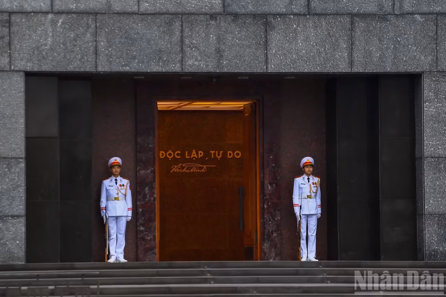 The main entrance to the Ho Chi Minh Mausoleum is opened before the flag-raising ceremony begins.