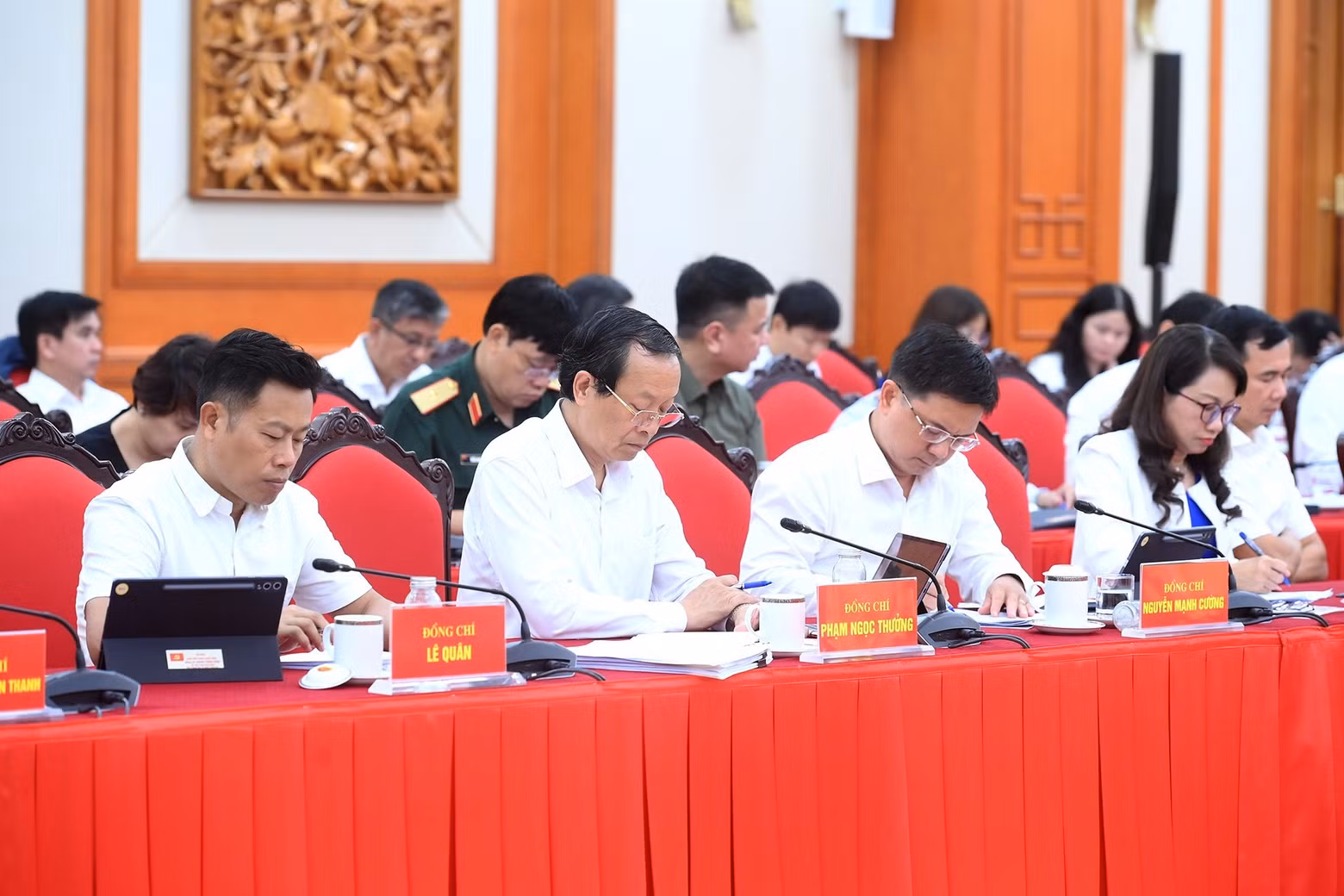 Delegates attend the working session.